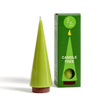 Green candle shaped like a tree with its packaging on a white background