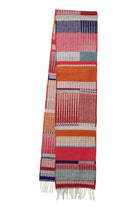 Multicolored woven scarf with a pattern on a white background