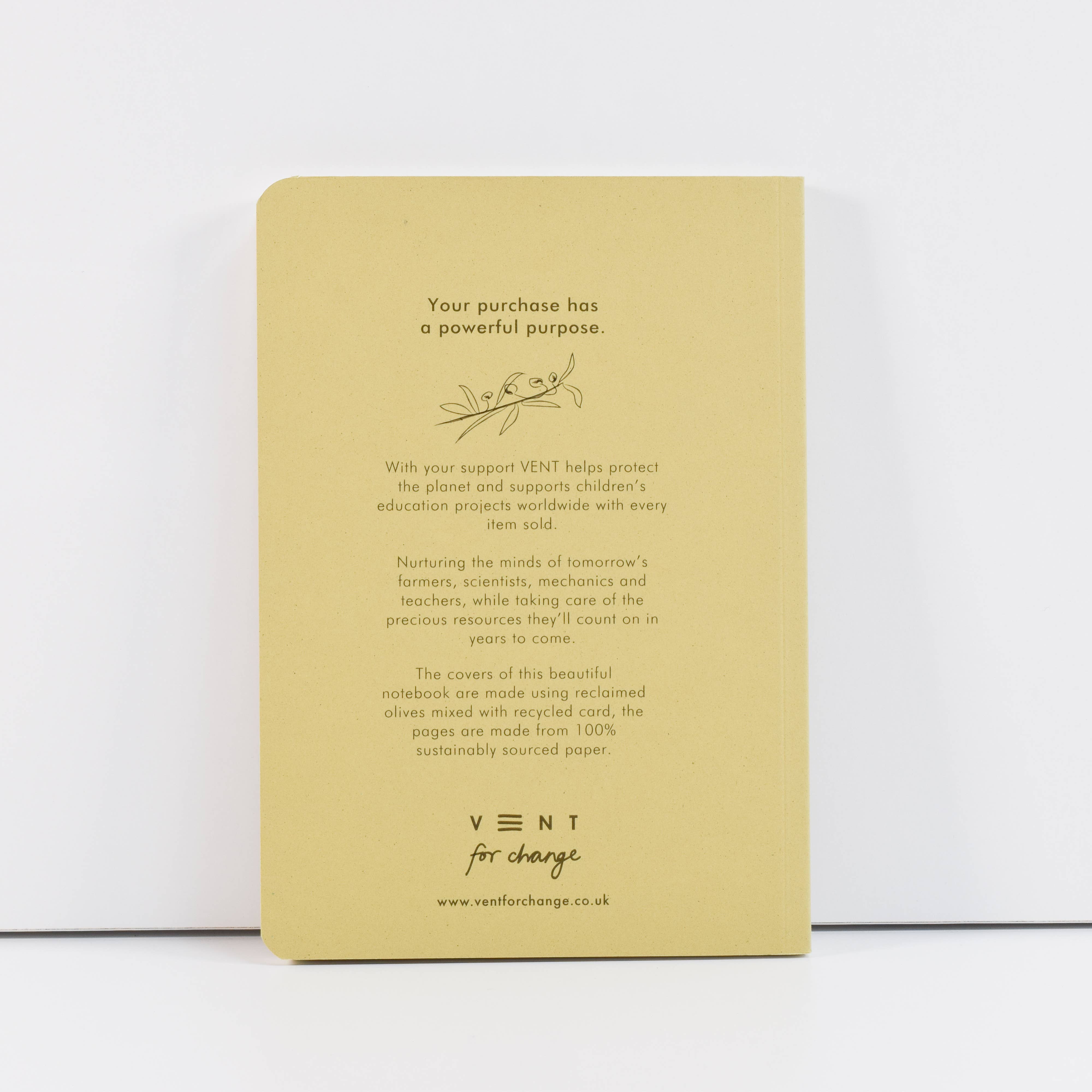 Beige notebook with text and branding on a white background