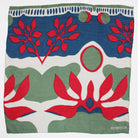 Fabric with red, green, and blue abstract floral pattern