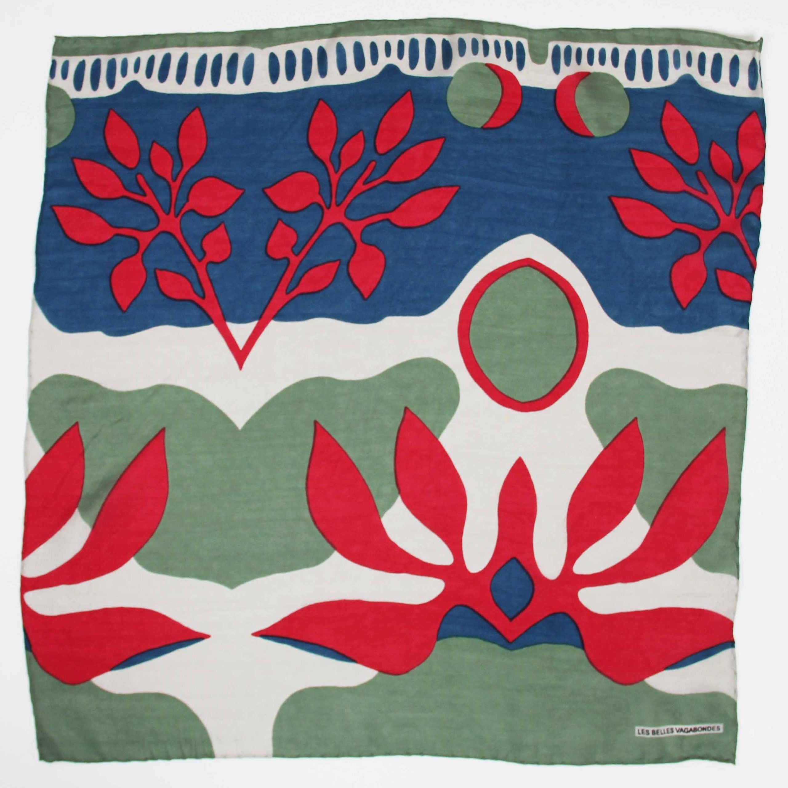 Fabric with red, green, and blue abstract floral pattern