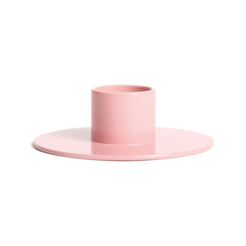 Pink candle holder on a white background