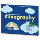 Sunography solar-powered photography kit packaging with blue background and cloud designs.