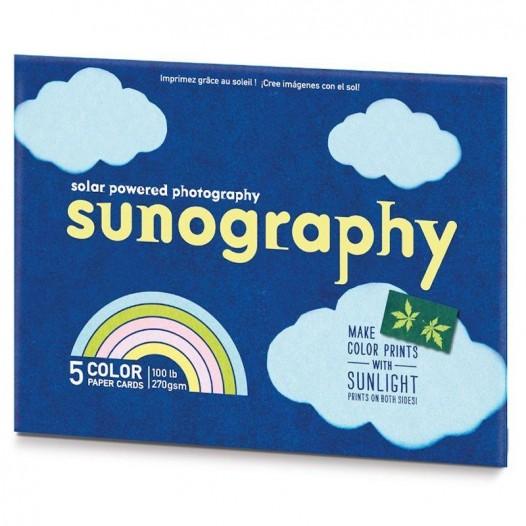 Sunography solar-powered photography kit packaging with blue background and cloud designs.