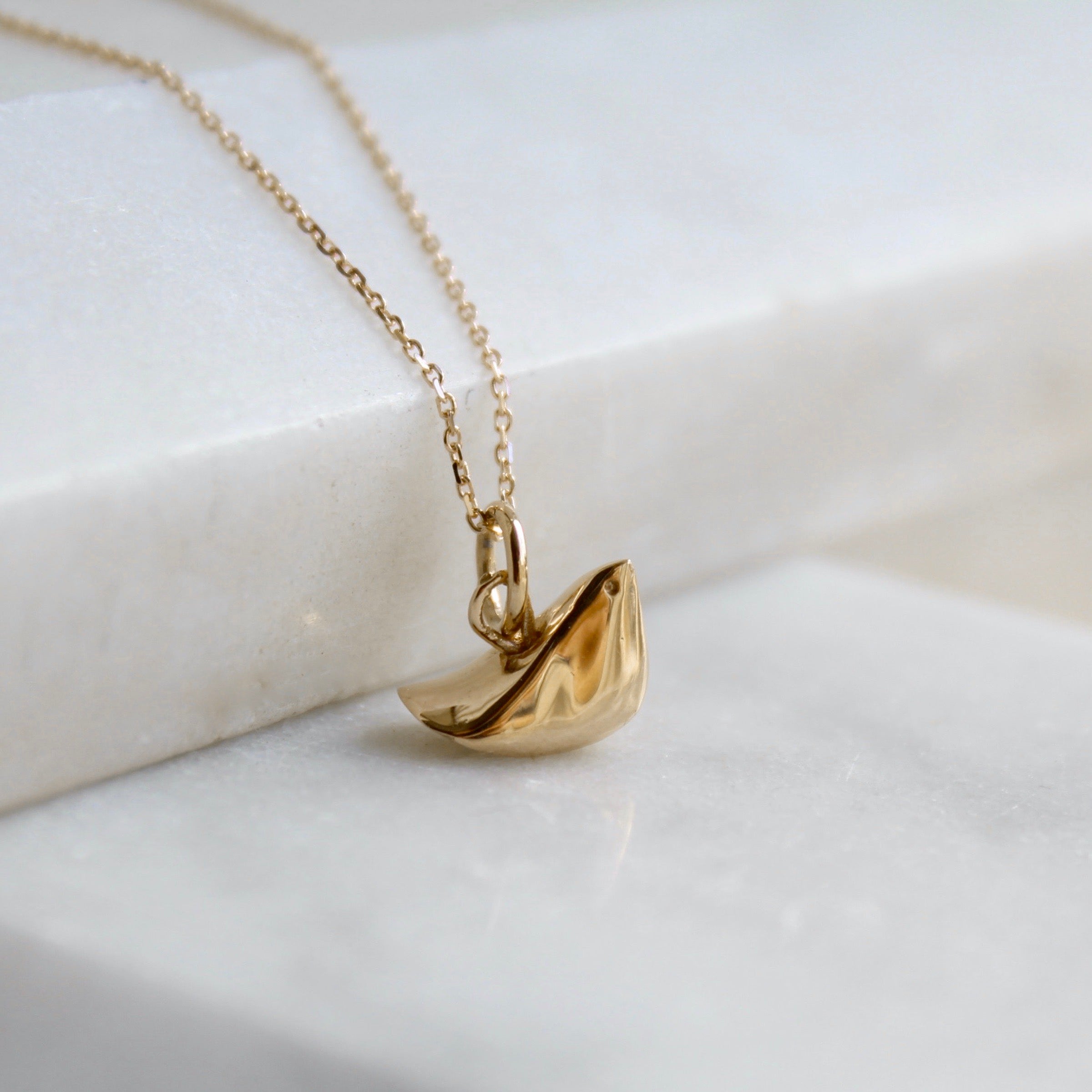 Solid gold bird necklace