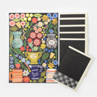 Floral design card with blackboard and magnets on a white background