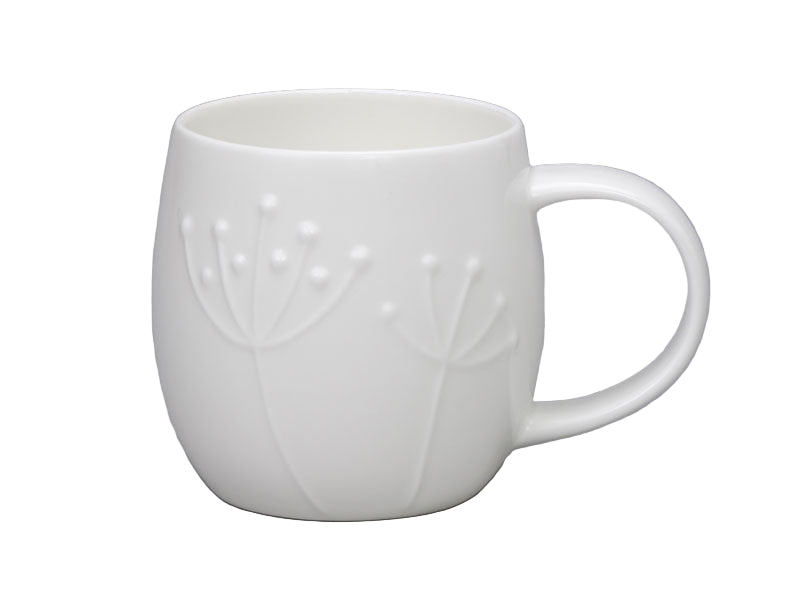 White ceramic mug with subtle embossed design on a gray background