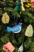 Colorful Christmas ornaments hanging on a tree