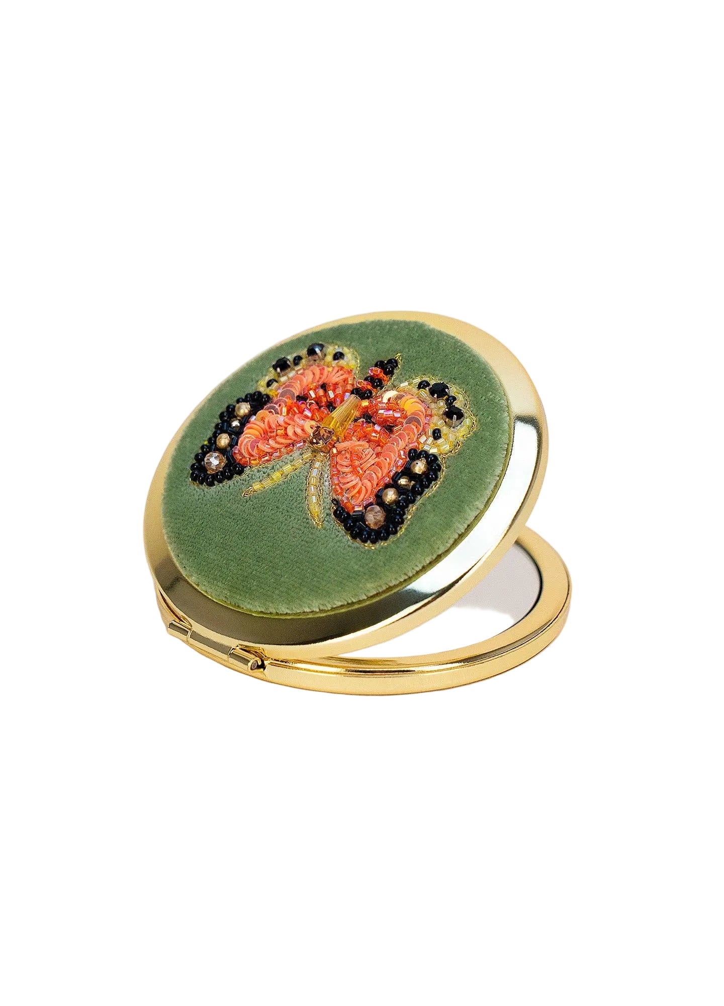 Compact mirror with butterfly design on a white background