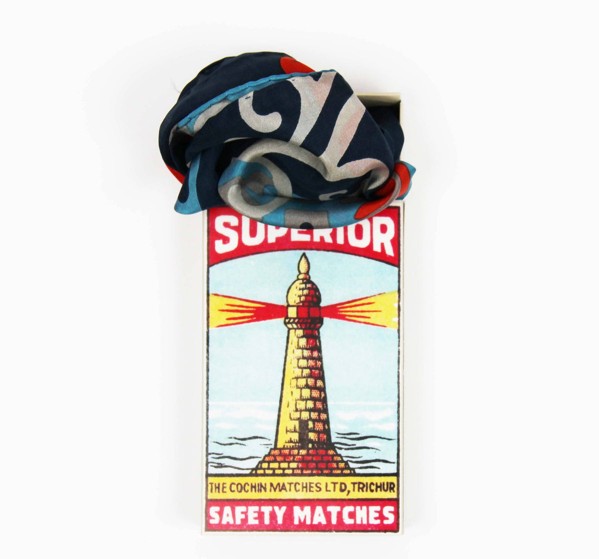 Matchbox with a colorful matchstick on a white background