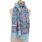 Scarf with floral pattern on a mannequin against a white background
