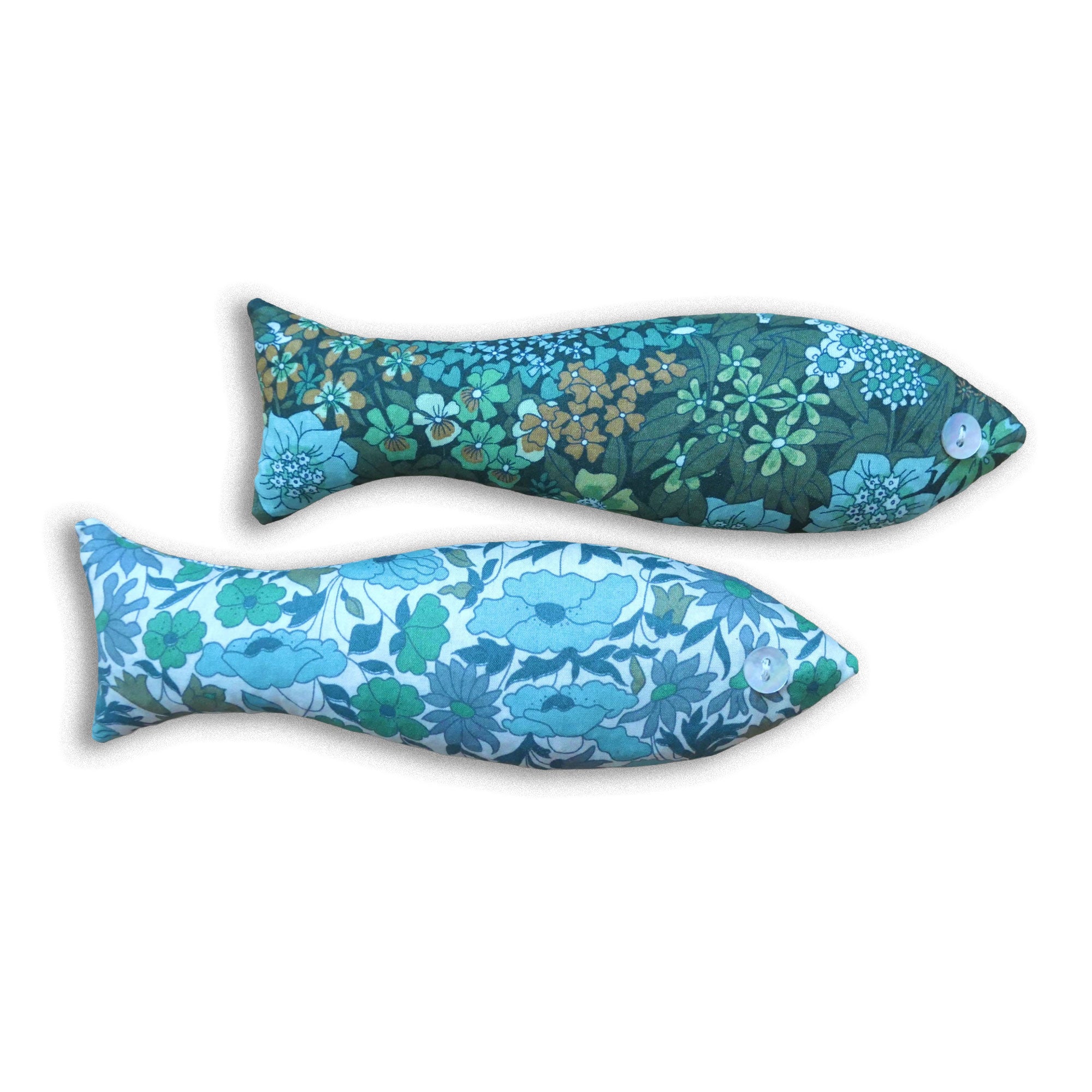 Two fish-shaped sachets with green floral patterns on a white background