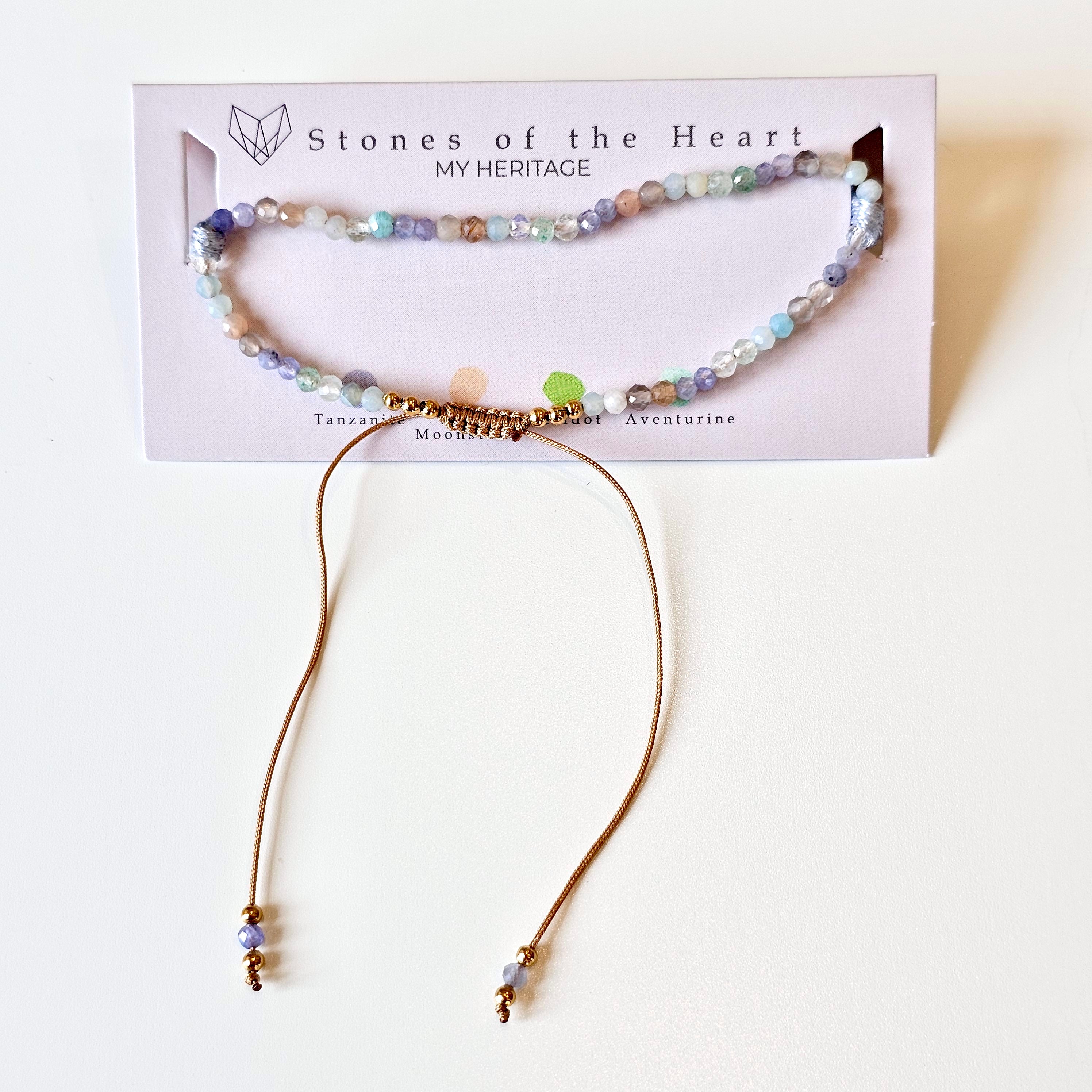 Beaded gemstone and gold bracelet on card with Stones of the Heart branding.