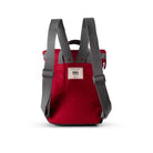 Red backpack with gray straps on a white background - view of back of product showing padded back and adjustable straps.
