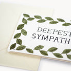 Greeting card with 'Deepest Sympathies' text and leaf design on a white background