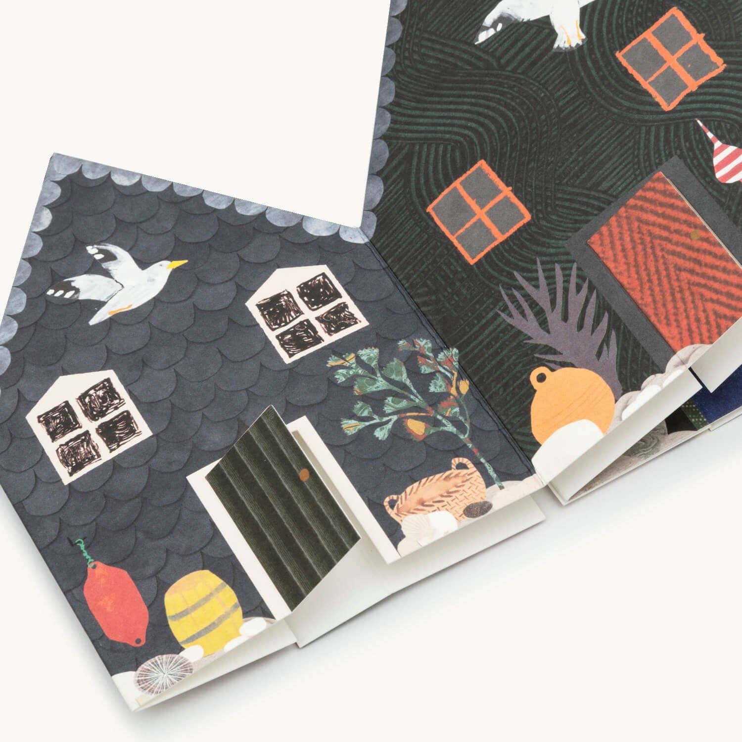 Concertina greetings card featuring houses and animals on a white background
