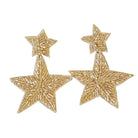 Star-shaped earrings embellished gold beads shown on a white background