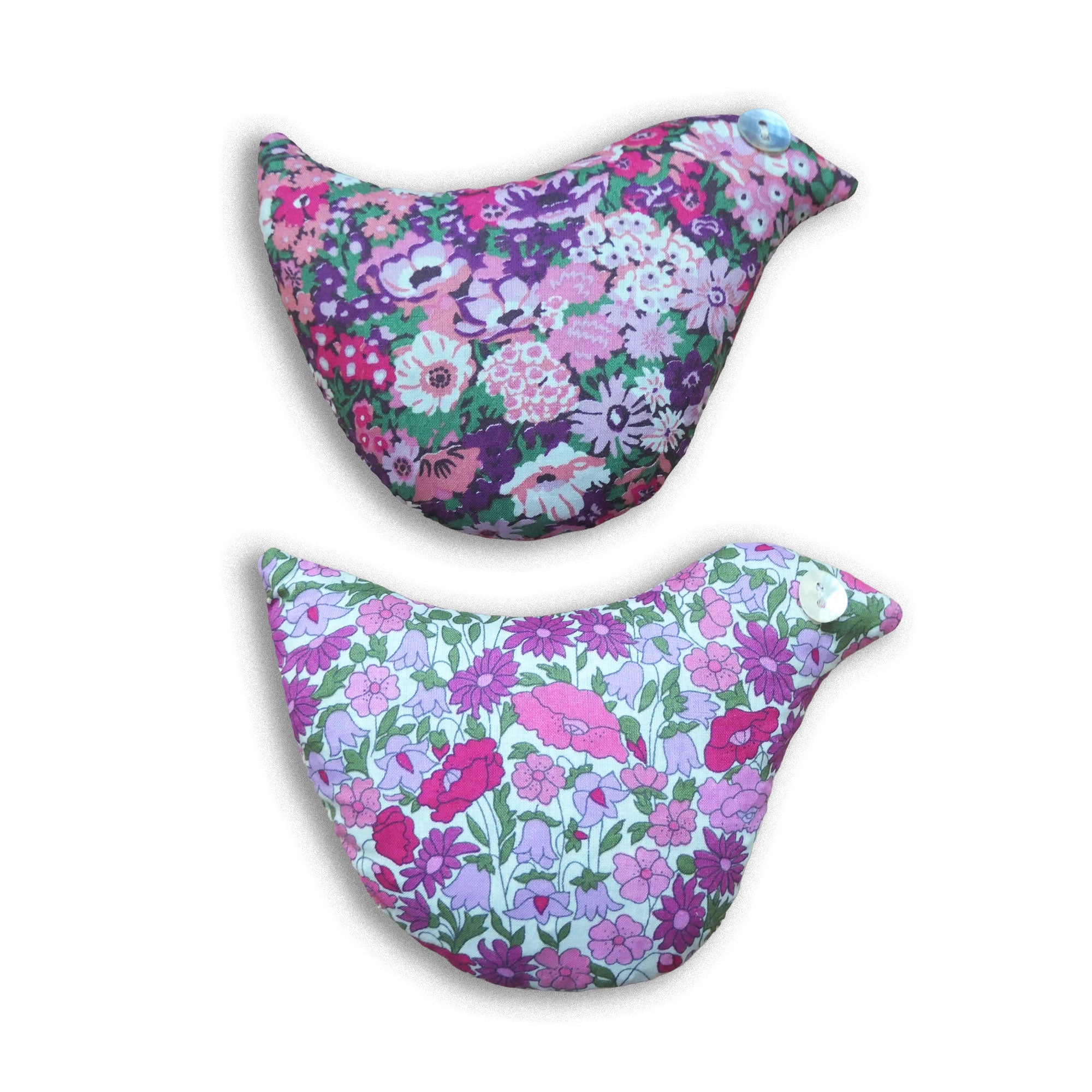 Two floral-patterned bird shaped sachets on a white background