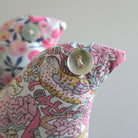 Liberty Floral fabric lavender sachet with a button on a grey background