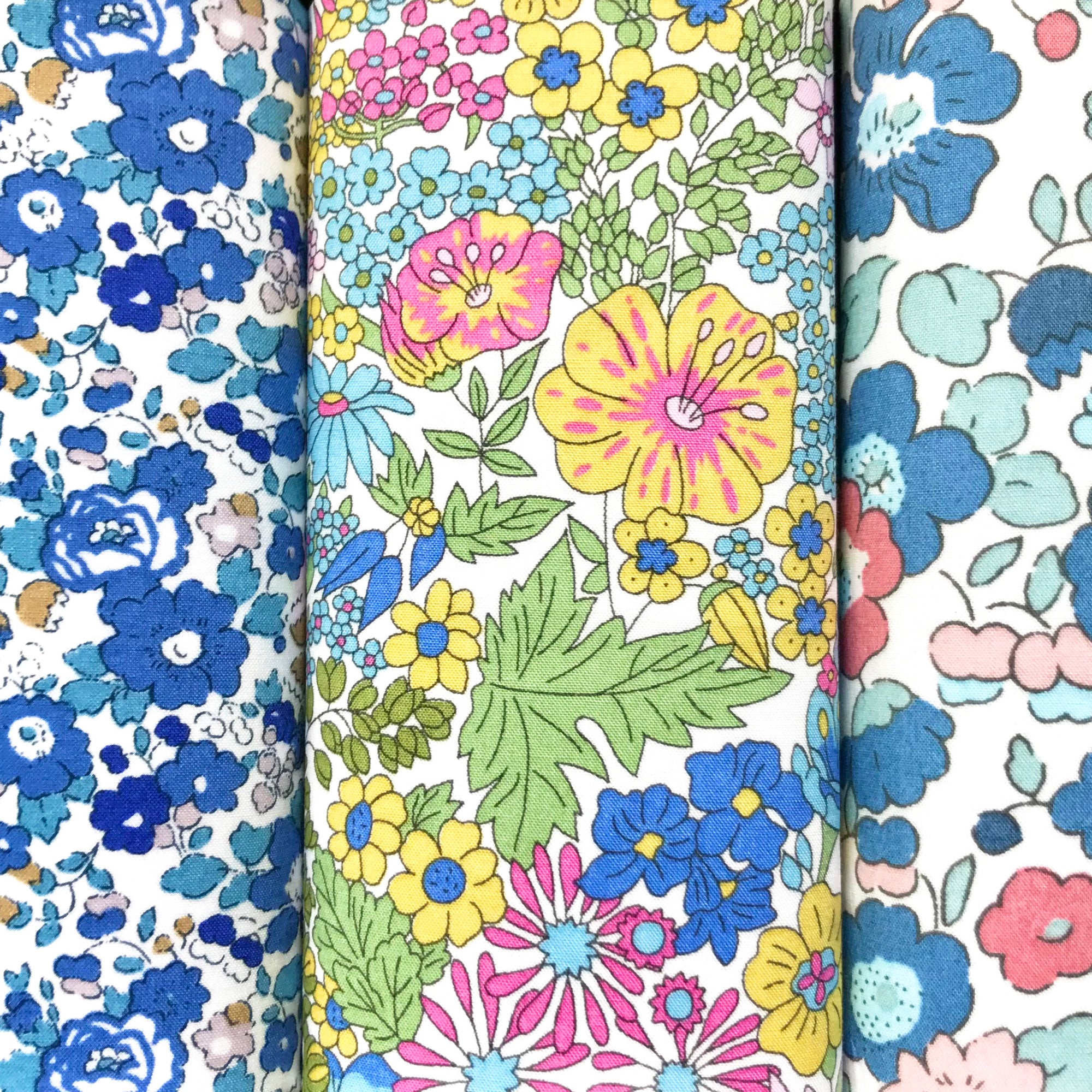 Three cotton hankies in pastel blue, yellow and pink