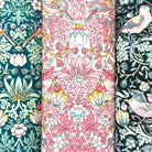 Three cotton hankies with floral and nature-themed patterns.
