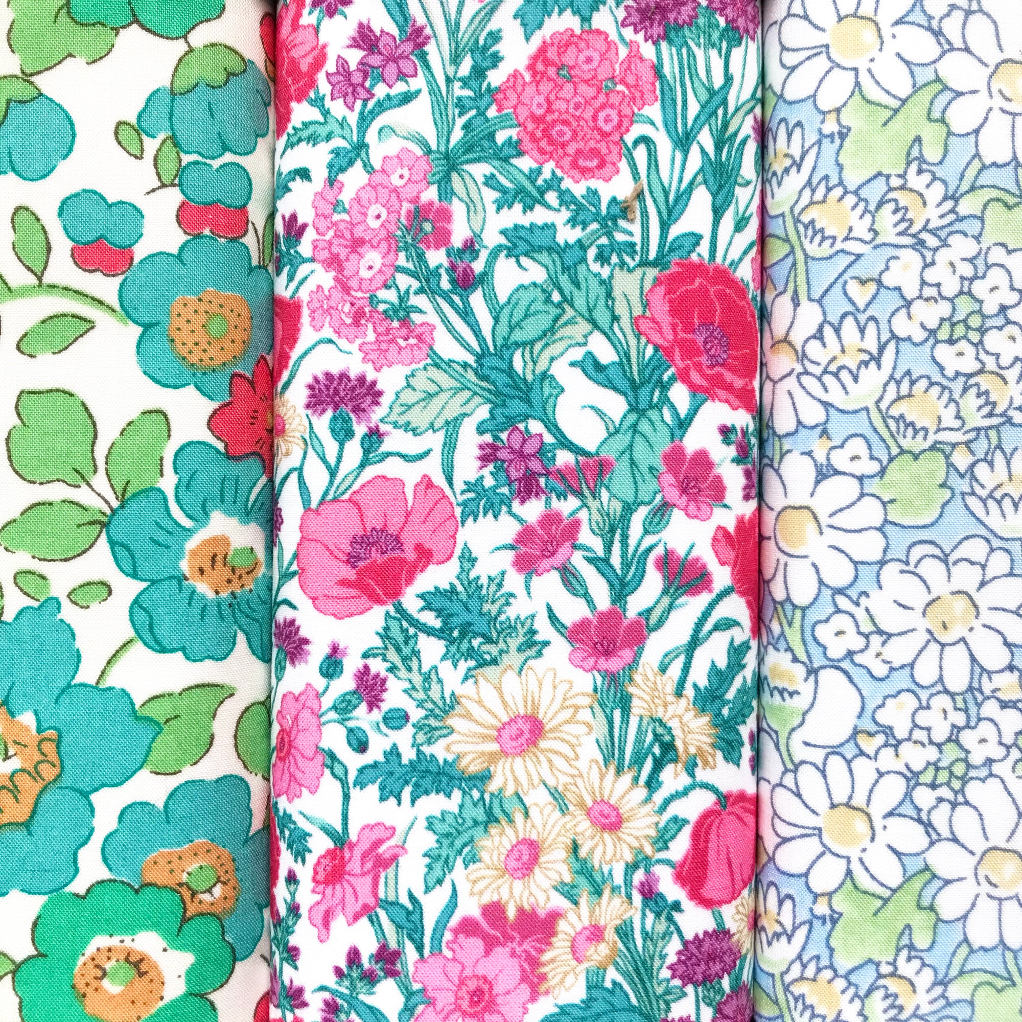 Three floral cotton hankies with different patterns.