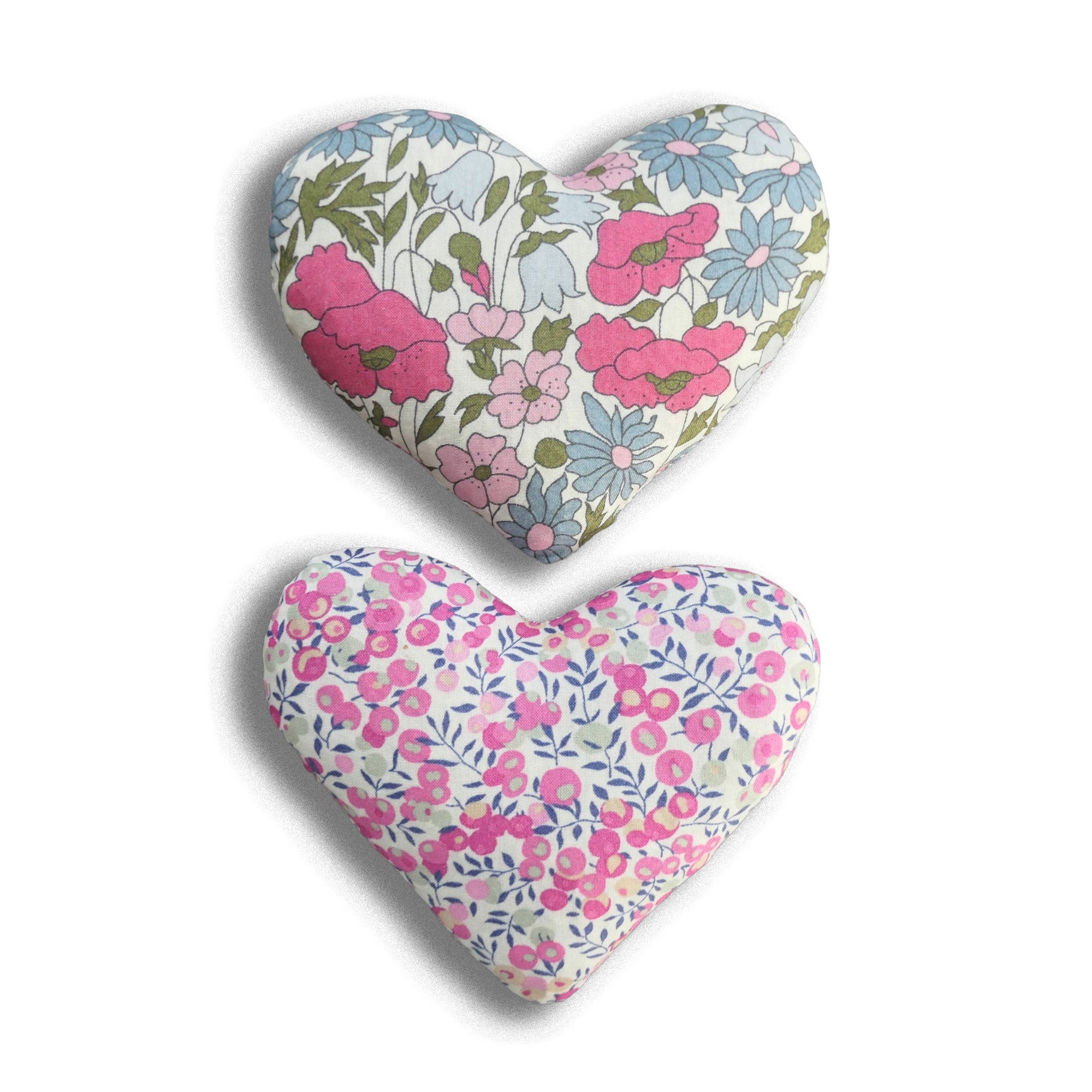 Two heart-shaped floral lavender bags on a white background