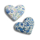 Two heart-shaped cotton lavender bags with floral patterns on a white background