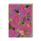 Greeting card with colourful bird and floral design on a pink and purple patterned background