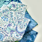 Floral patterned hanky with blue and green colours on a white background