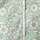 Close-up pyjama with a floral pattern on a green background
