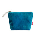 Blue velvet pouch with a gold zipper on a white background