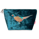 A teal velvet cosmetic pouch featuring an embroidered pheasant bird on the front, with a silver zipper closure and a small pink tag on the side.