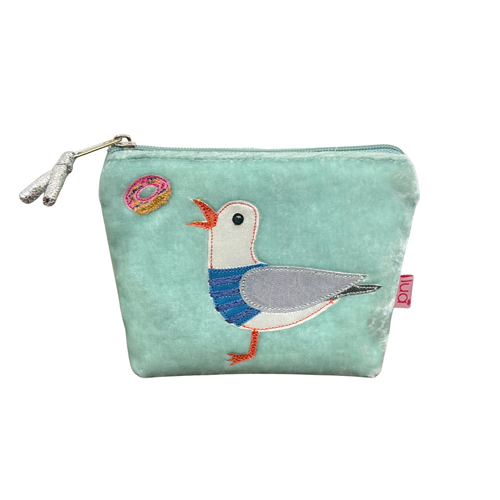 Small pouch with a seagull design on a light blue background