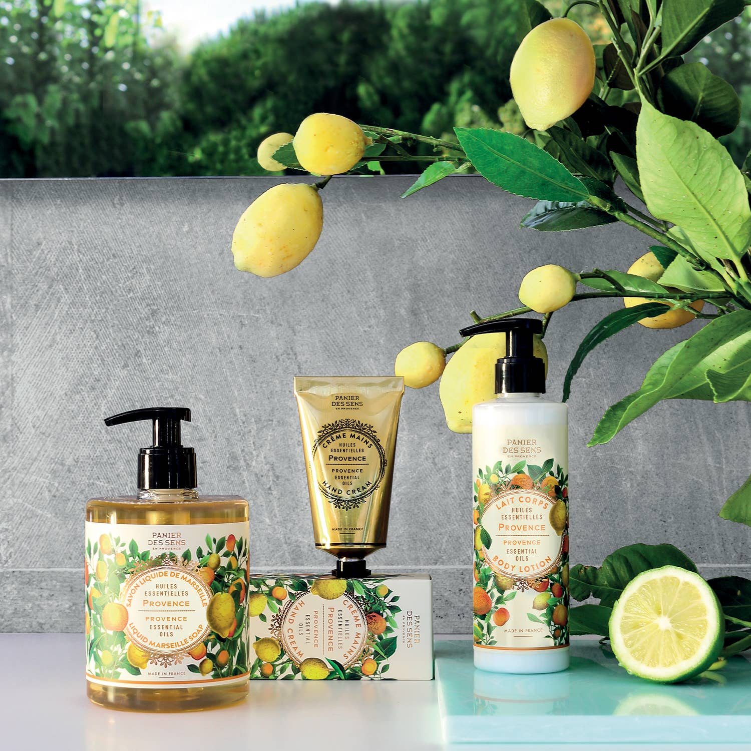 Set of skincare products with lemon design on a grey background