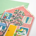 Decorative card with a collage of a house with a green envelope