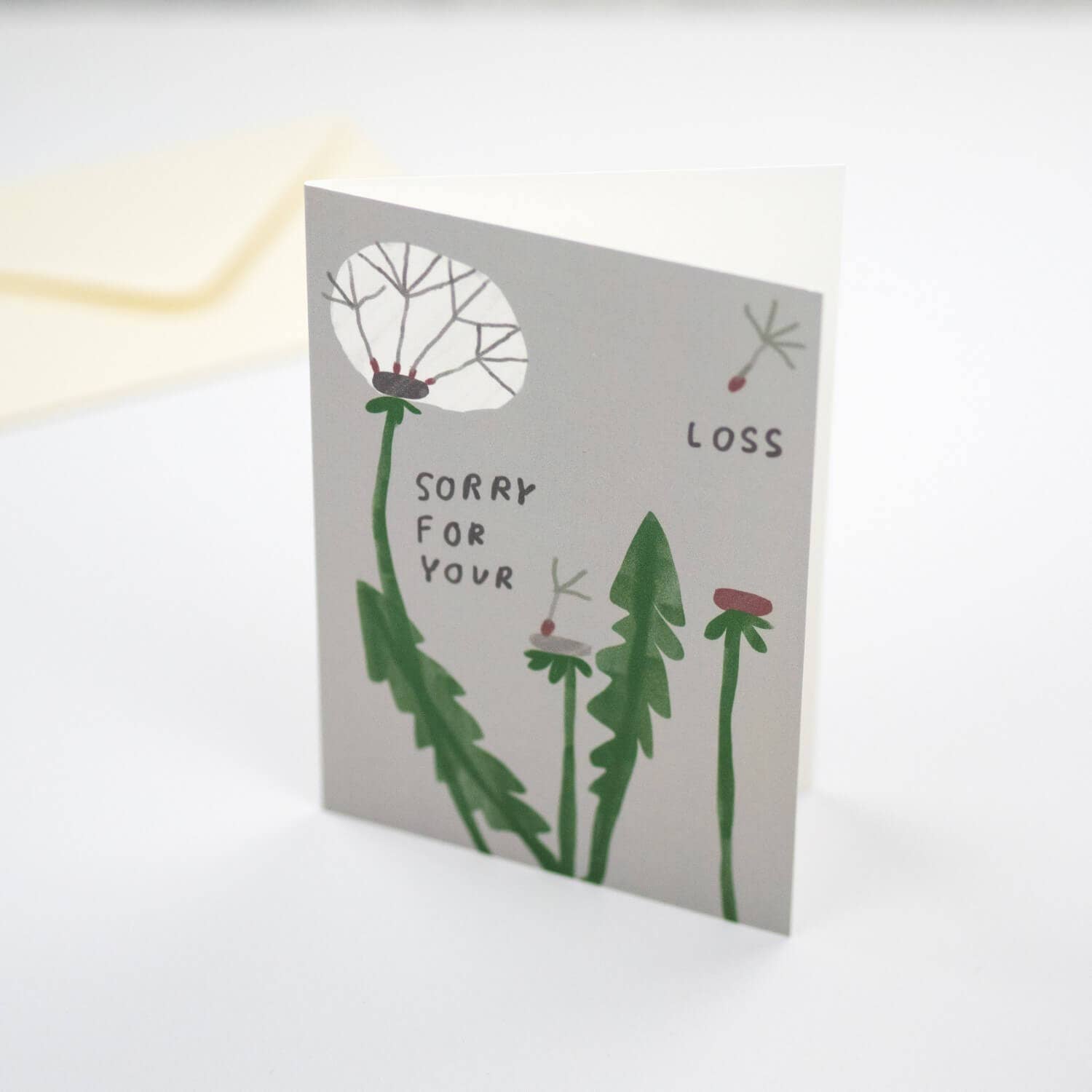 Card with dandelion illustration and text 'Sorry for your loss' on a white background