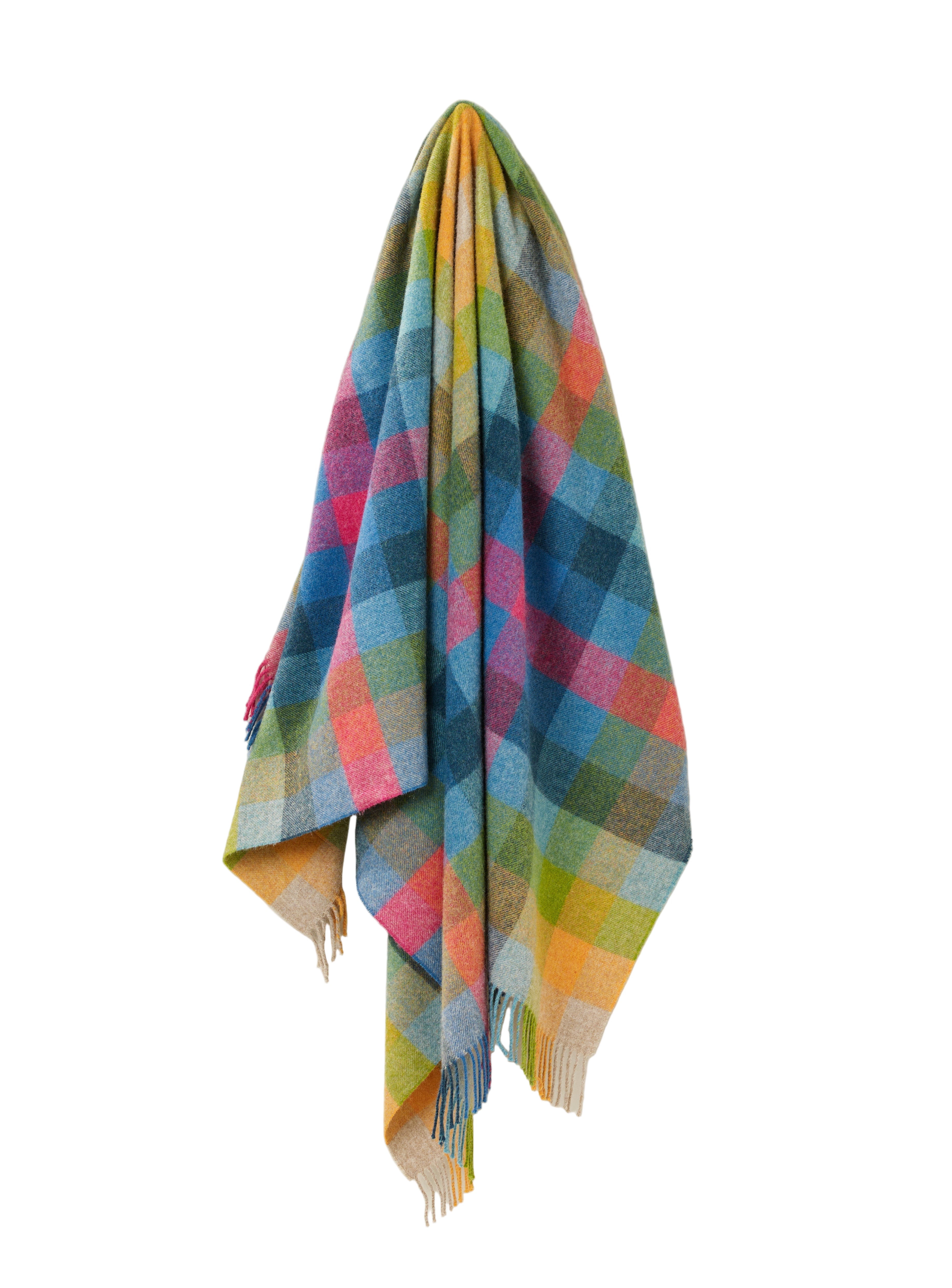 Multicoloured plaid blanket draped on a white background
