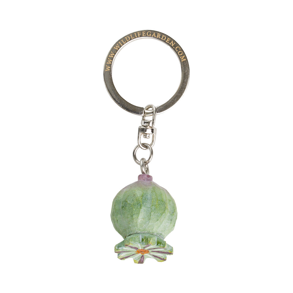 Keychain with green glass bead and metal ring on a white background