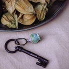 Keychain with decorative element on a textured surface