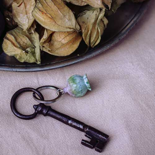 Keychain with decorative element on a textured surface