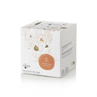 Product packaging with floral design and text on a white background