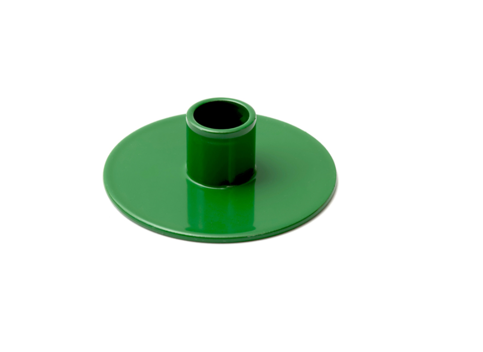 Green plastic component on a white background