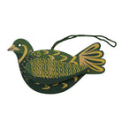 Decorative green and gold bird ornament on a white background