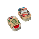 Two small cylindrical candles in cardboard tins with 'After Party' branding on a white background.