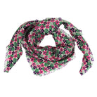A lightweight square scarf with a dense floral print featuring pink and purple flowers, green leaves, and dark purple berries on a white background with fringed edges.