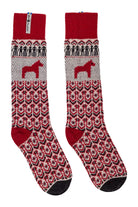 A pair of crew socks with a red, gray, and black Nordic/Fair Isle pattern, featuring a red Dala horse motif and a red ribbed cuff, shown against a plain white background.
