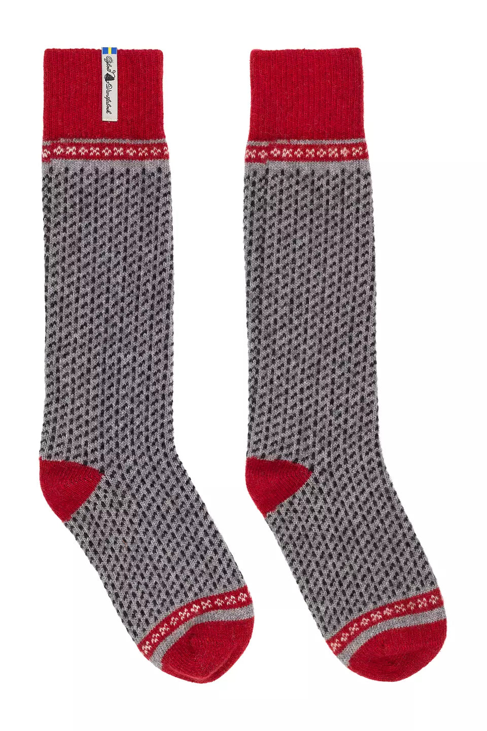 A pair of crew socks with a gray and red Nordic pattern, featuring solid red heels, toes, and cuffs, displayed against a plain white background.